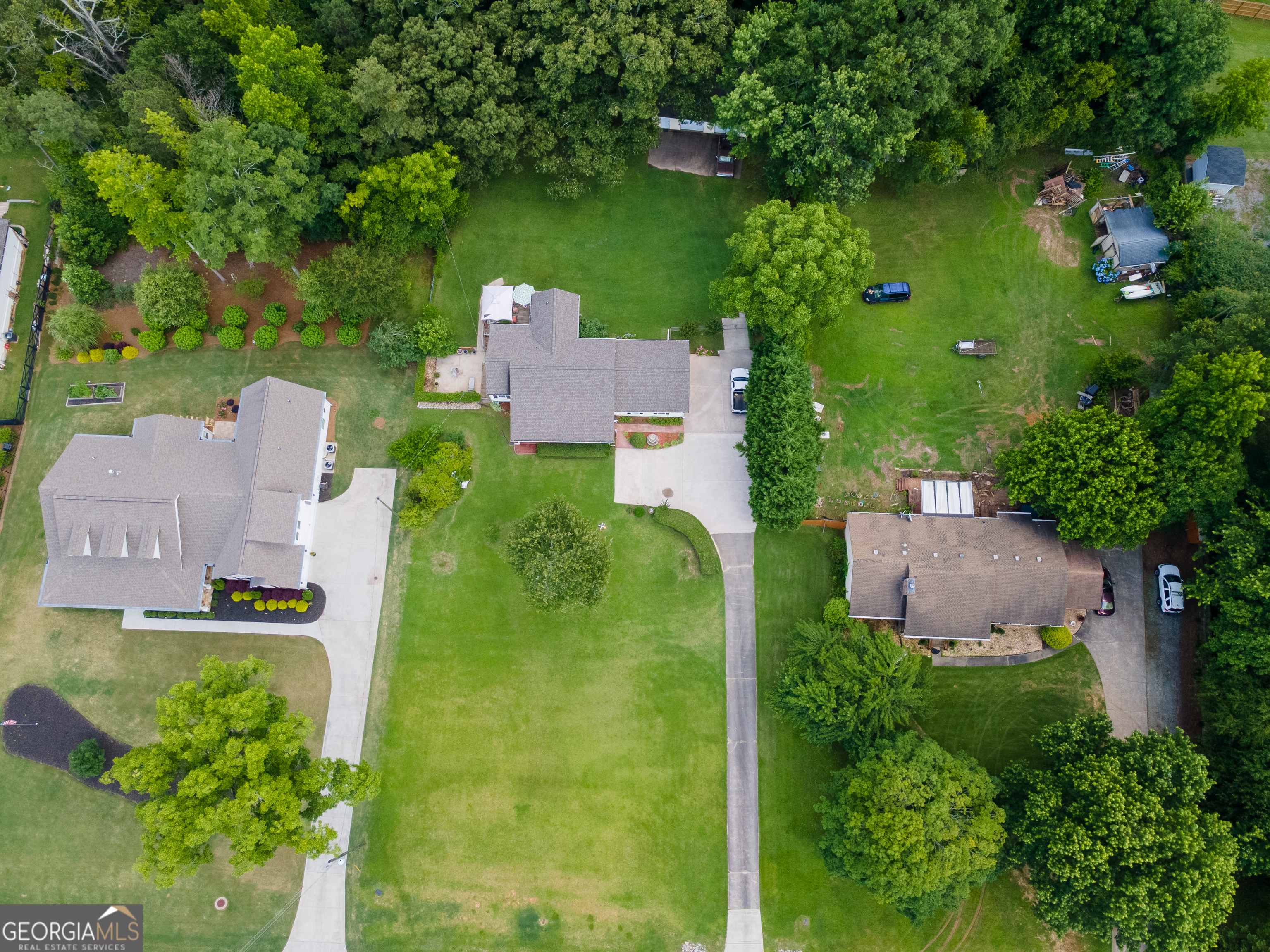 4017 South South Bogan Road Buford, GA 30519 - Photo 5 of 11 an aerial view of a house with a yard basket ball court and outdoor seating