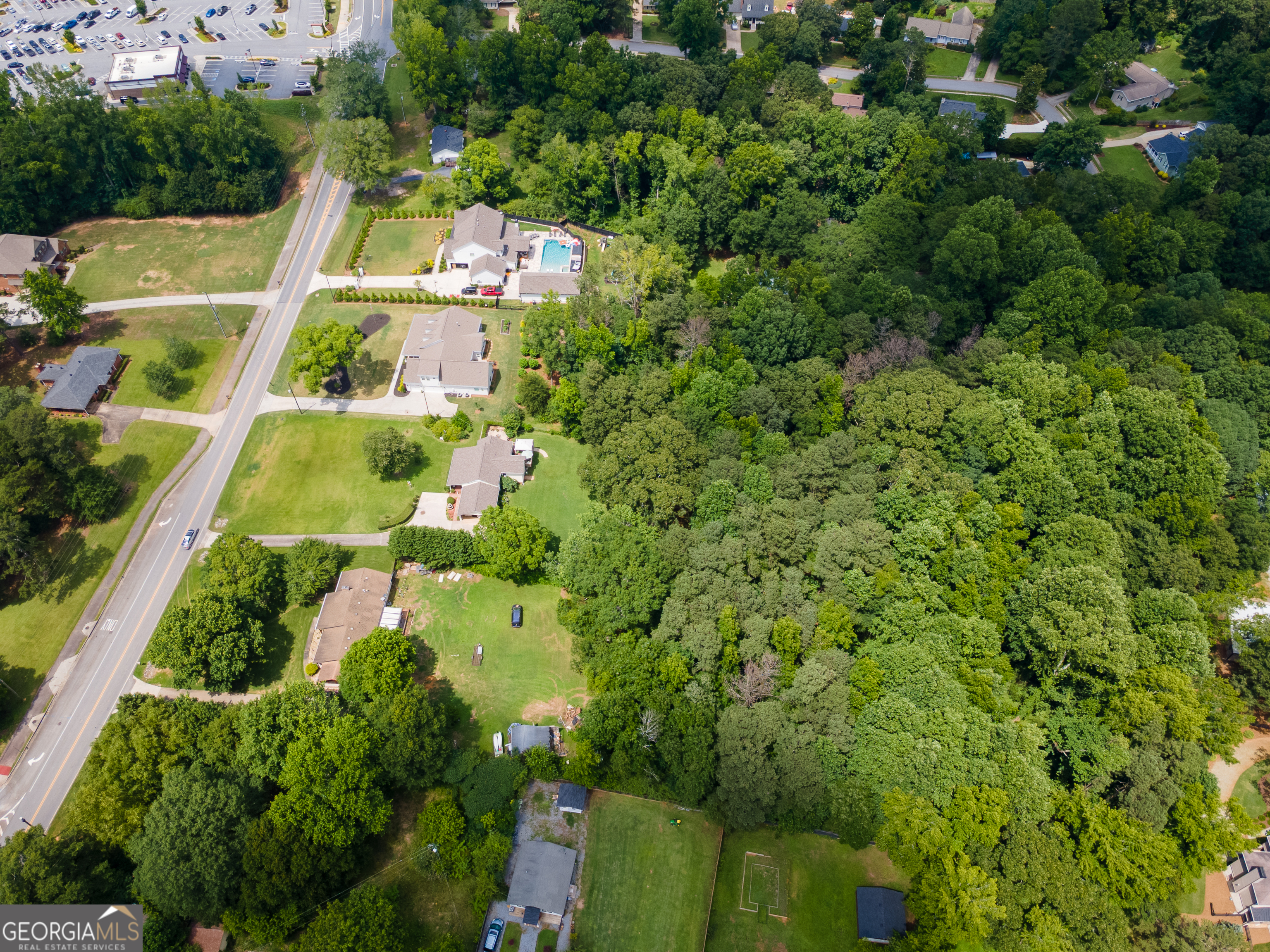 4017 South South Bogan Road Buford, GA 30519 - Photo 7 of 11 an aerial view of residential houses with outdoor space