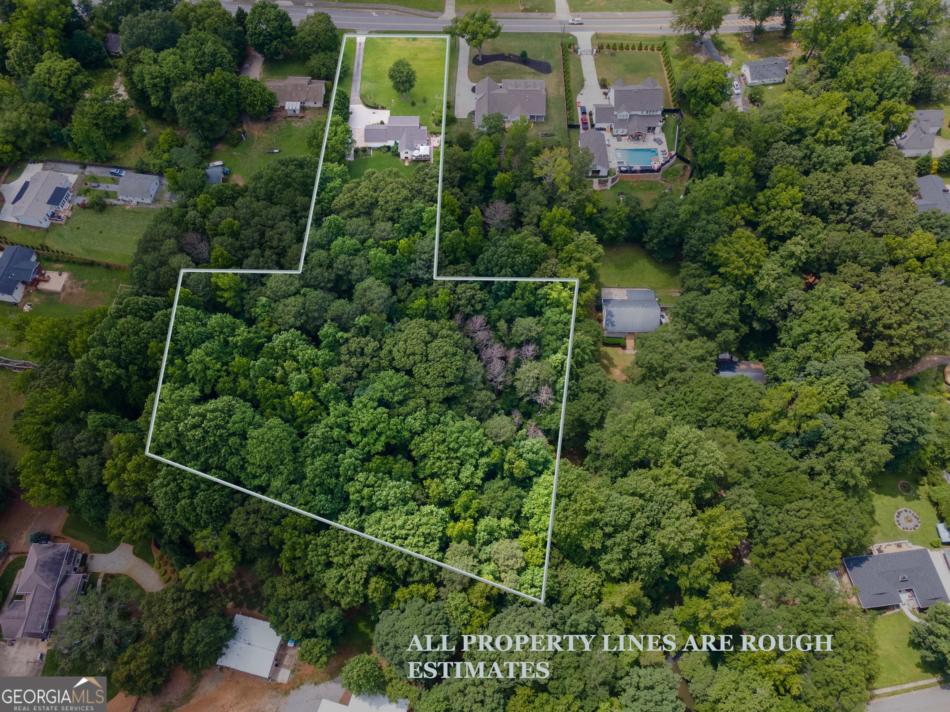 4017 South South Bogan Road Buford, GA 30519 - Photo 8 of 11 an aerial view of a house and lots of trees