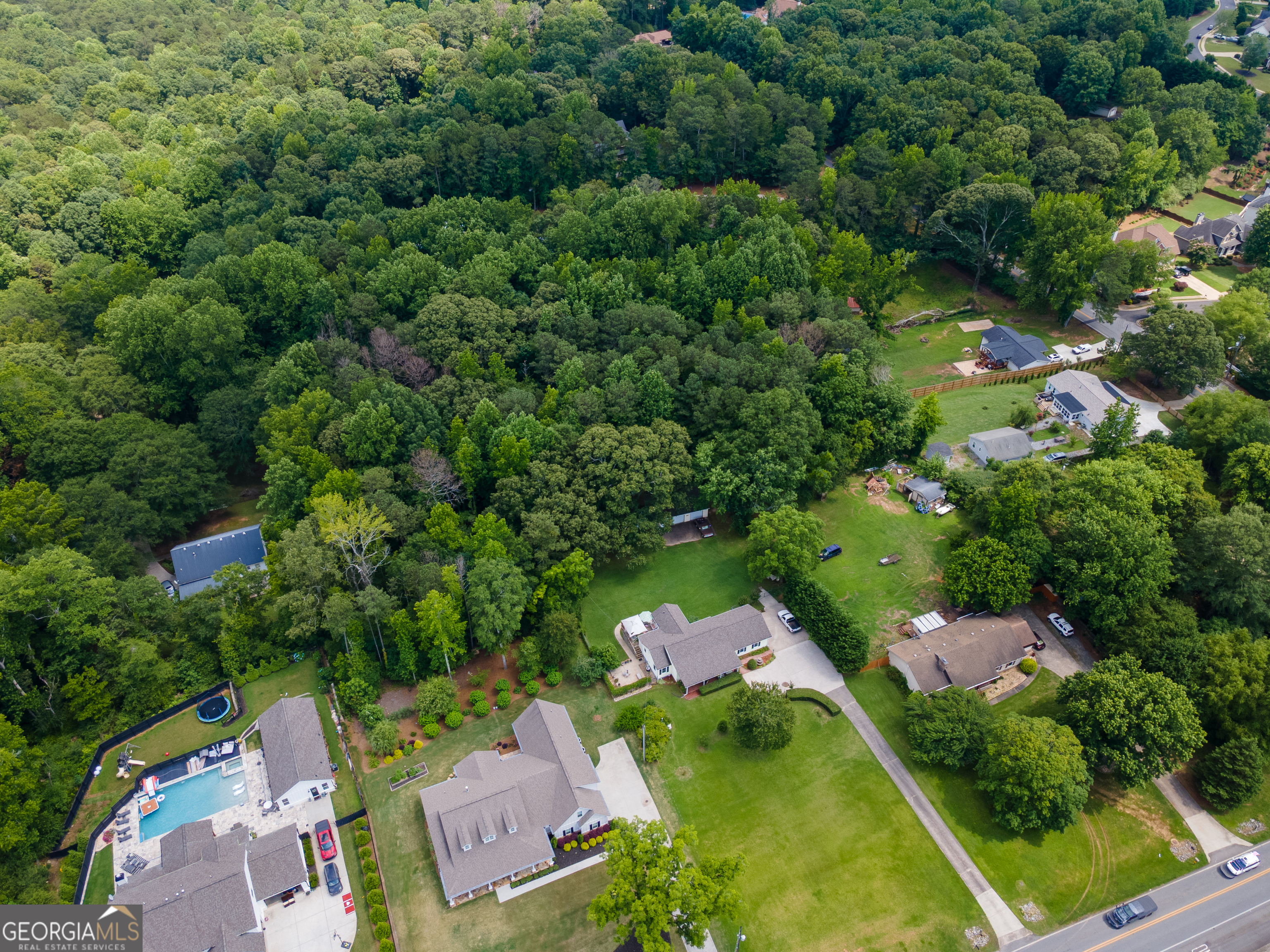 4017 South South Bogan Road Buford, GA 30519 - Photo 10 of 11 an aerial view of a house with a yard