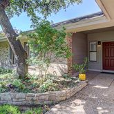 a front view of a house with a yard garage and outdoor seating