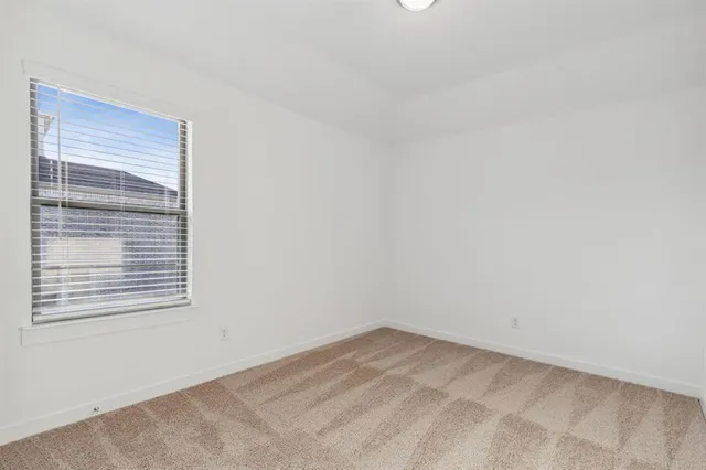 a view of a room that has a window in it