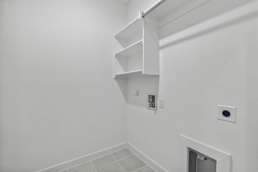 858 Sunflower Road Lavon, TX 75166 - Photo 29 of 31 Utility room in the Oak II home plan by Trophy Signature Homes – REPRESENTATIVE PHOTO