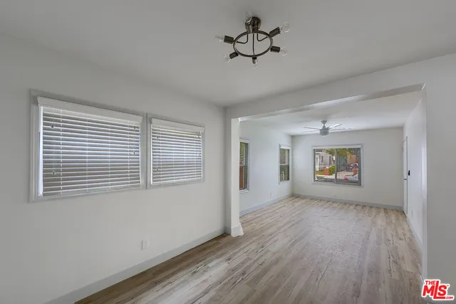 a kitchen with wooden cabinets stainless steel appliances and a sink