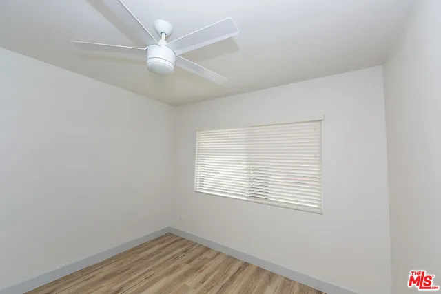 a kitchen with stainless steel appliances a stove a microwave and sink