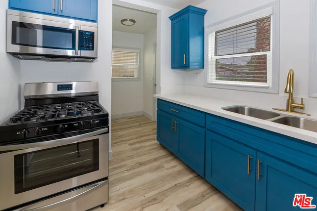 a bathroom with a bathtub shower sink and toilet