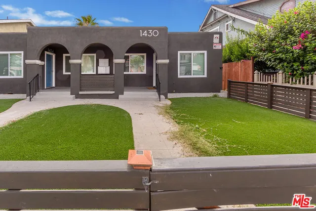 a kitchen with stainless steel appliances a refrigerator sink and microwave