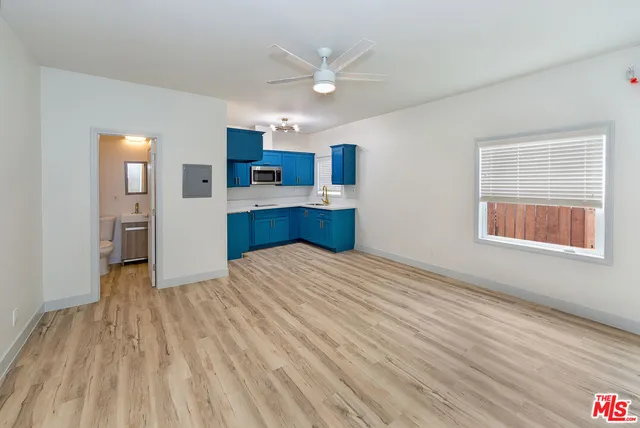 a kitchen with stainless steel appliances granite countertop wooden cabinets a sink and dishwasher