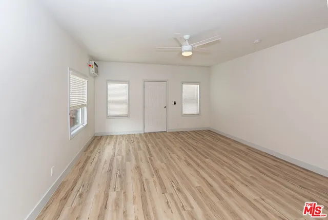 a bathroom with a shower sink and mirror