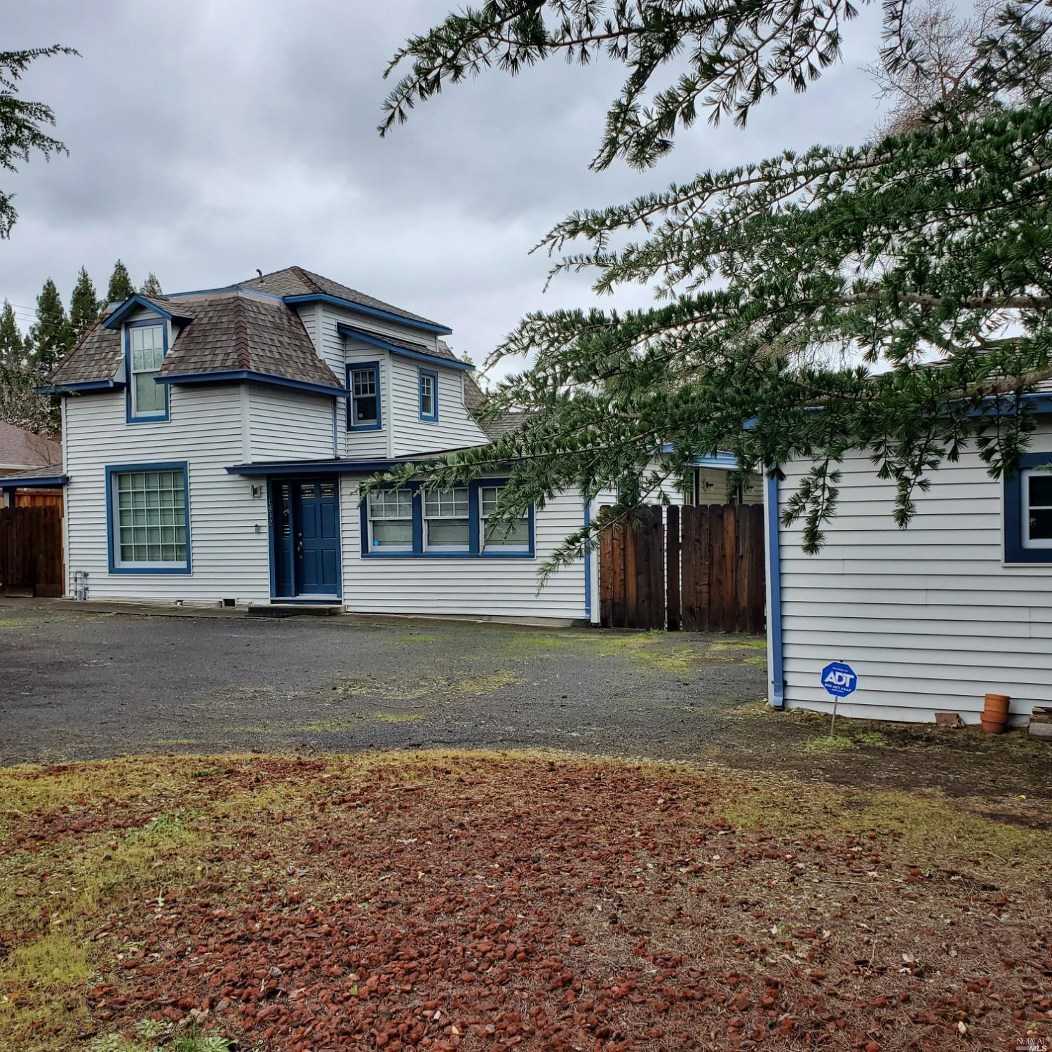 a view of a house with a yard