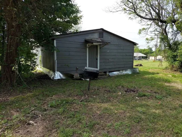 a backyard of a house with lots of green space