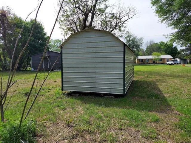 a view of a backyard with a garden