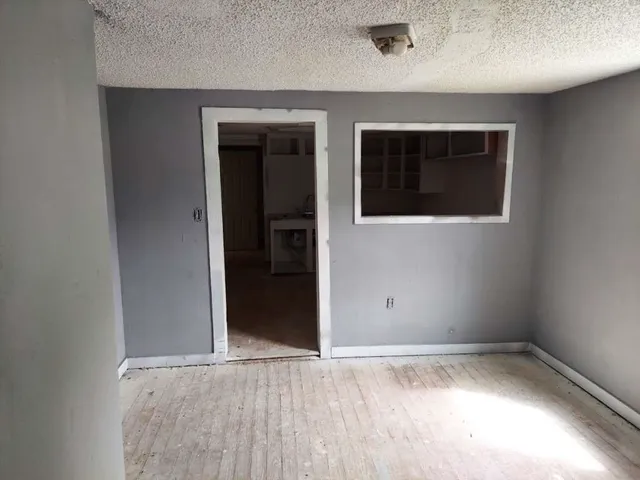 view of an empty room with a window