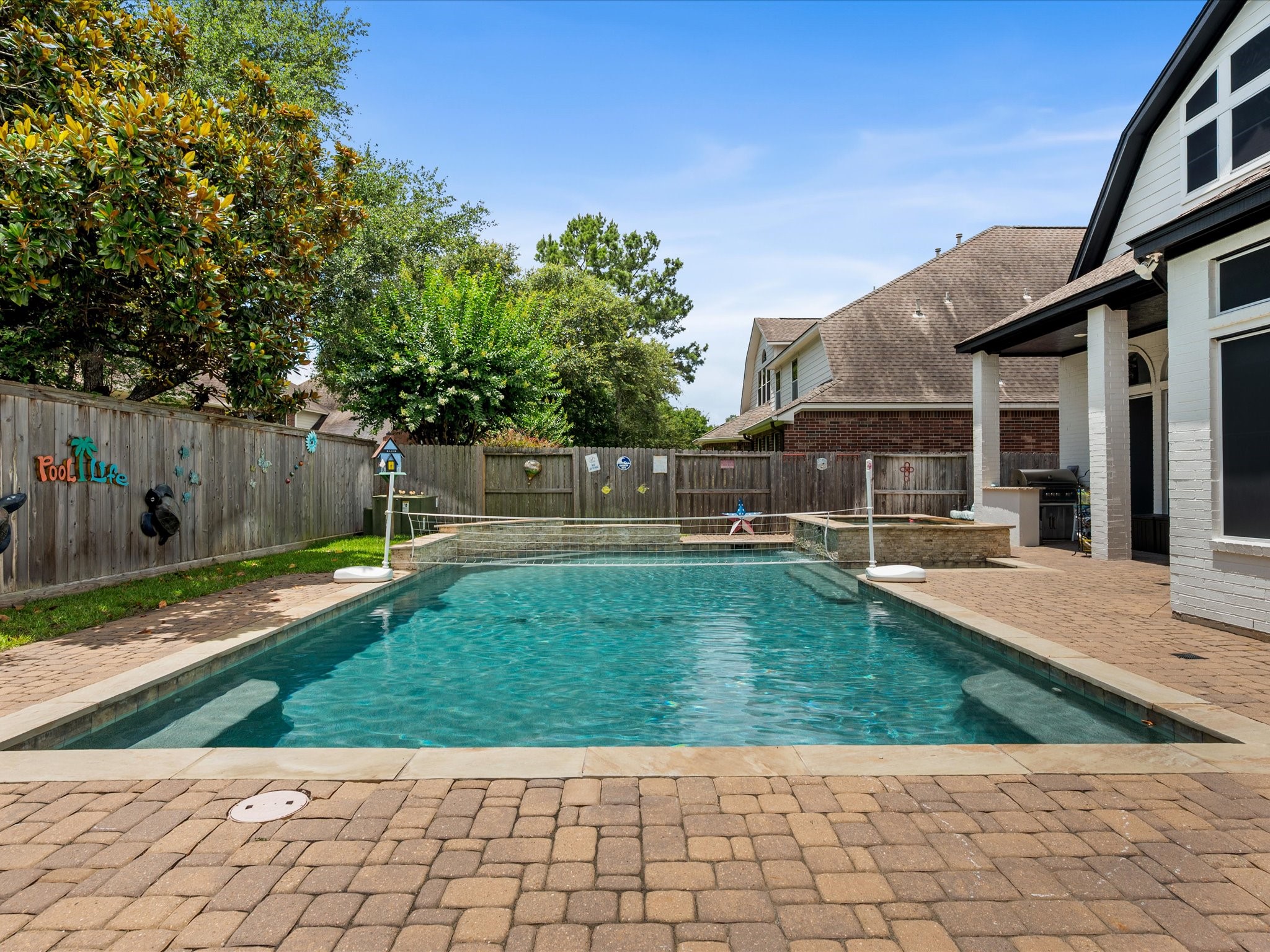 5910 Center Ct Drive Spring, TX 77379 - Photo 39 of 50 Recent enhancements throughout the backyard elevate both form and function, including updated equipment, recently replaced fence, and carefully designed outdoor living features that enhance the overall resort-style experience.