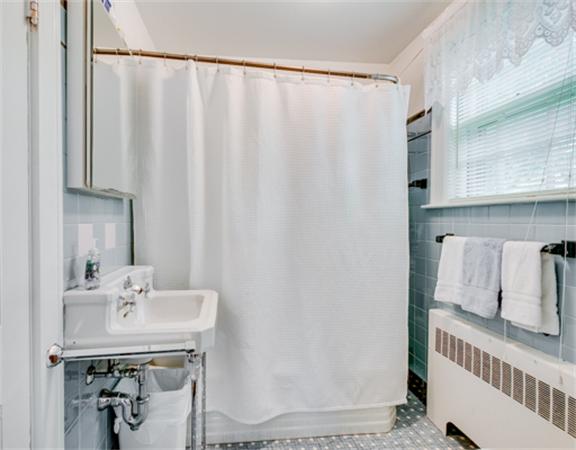 96 Columbia Road Arlington, MA 02474 - Photo 18 of 21 a bathroom with a sink and a mirror