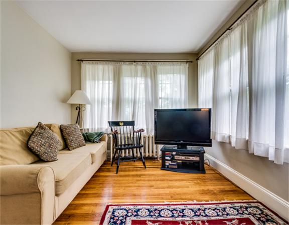 96 Columbia Road Arlington, MA 02474 - Photo 8 of 21 a living room with furniture and a flat screen tv