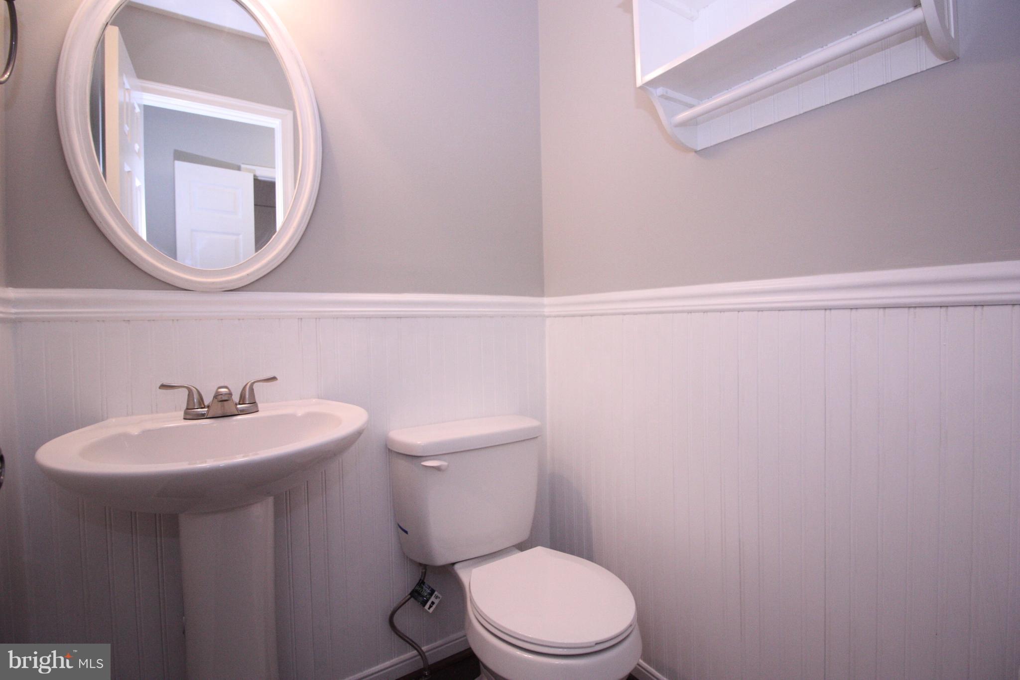 2218 Bear Den Road Frederick, MD 21701 - Photo 12 of 30 a bathroom with a sink a mirror and a toilet