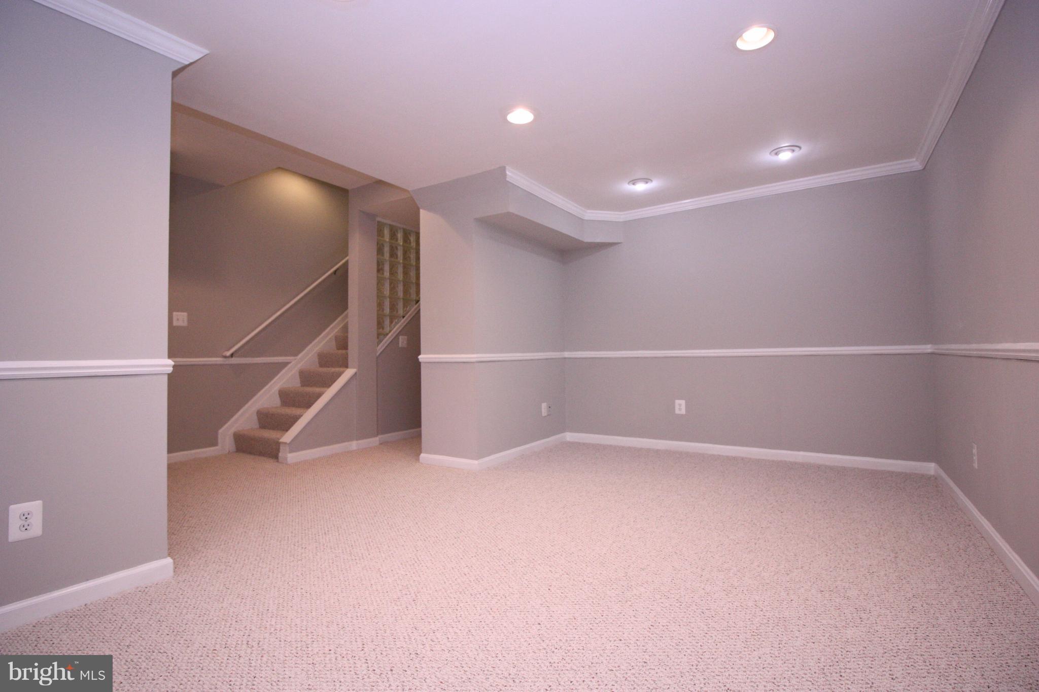 2218 Bear Den Road Frederick, MD 21701 - Photo 20 of 30 a view of an empty room with wooden floor and entryway