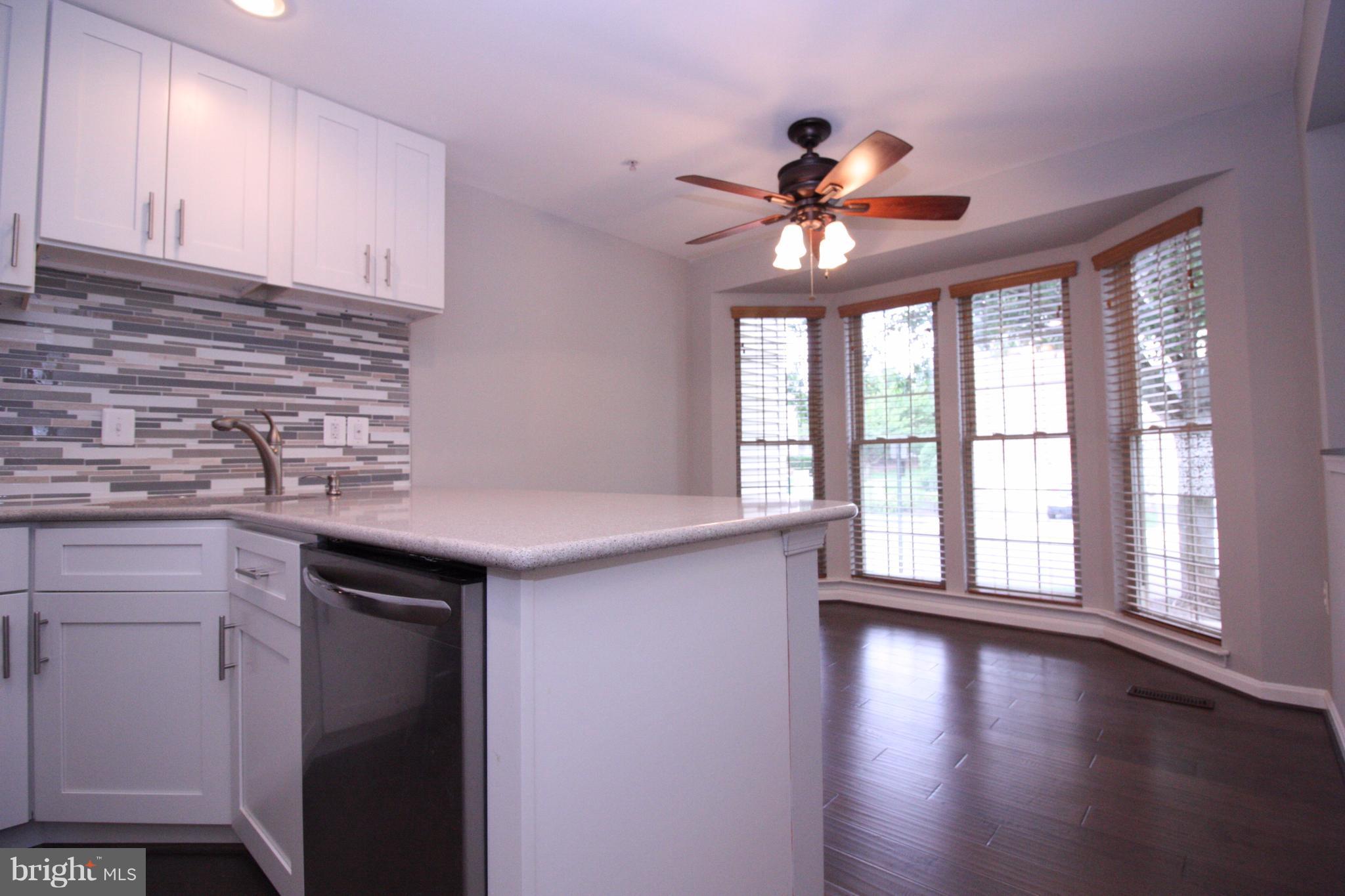2218 Bear Den Road Frederick, MD 21701 - Photo 3 of 30 a kitchen with a stove and a kitchen island
