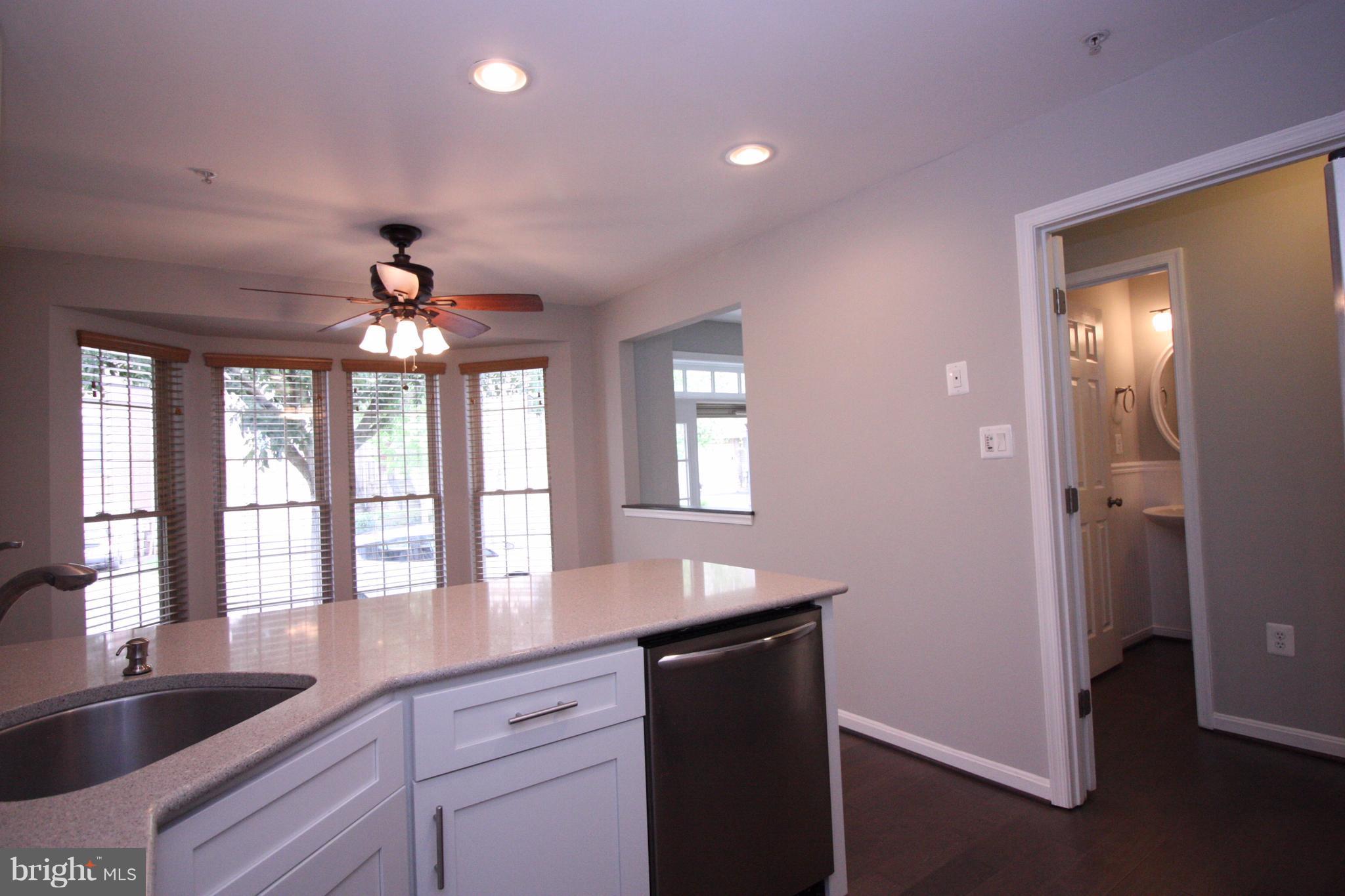 2218 Bear Den Road Frederick, MD 21701 - Photo 6 of 30 a kitchen with granite countertop a sink and dishwasher with granite countertops