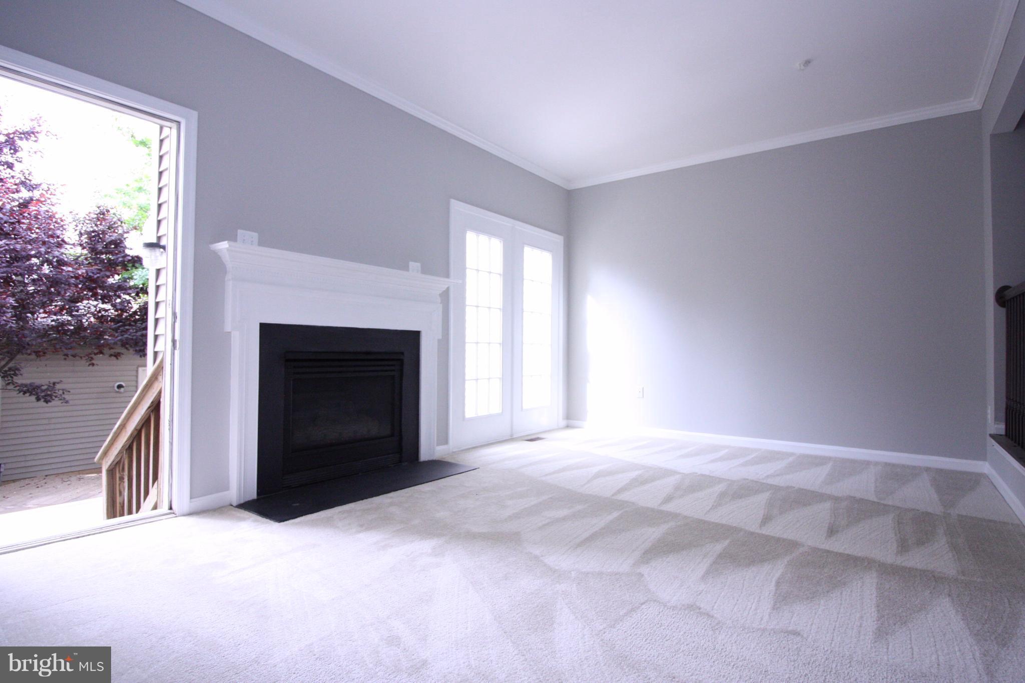 2218 Bear Den Road Frederick, MD 21701 - Photo 10 of 30 a view of empty room with a fireplace