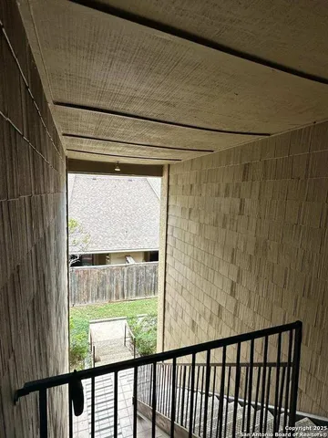 a view of a glass door with a balcony