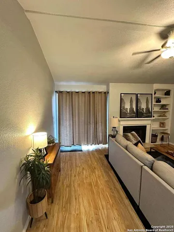 a living room with furniture and a lamp