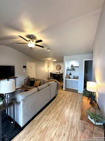 a large room with a lot of furniture and a wooden floor