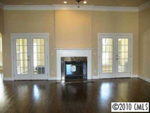3325 Williams Road Matthews, NC 28105 - Photo 2 of 8 a view of a livingroom with wooden floor and a fireplace