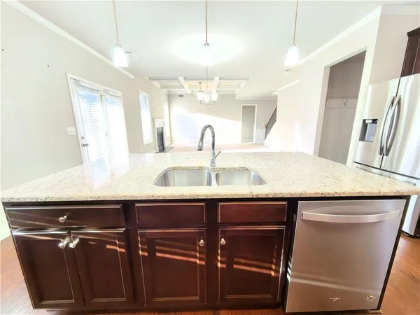 a bathroom with a granite countertop sink