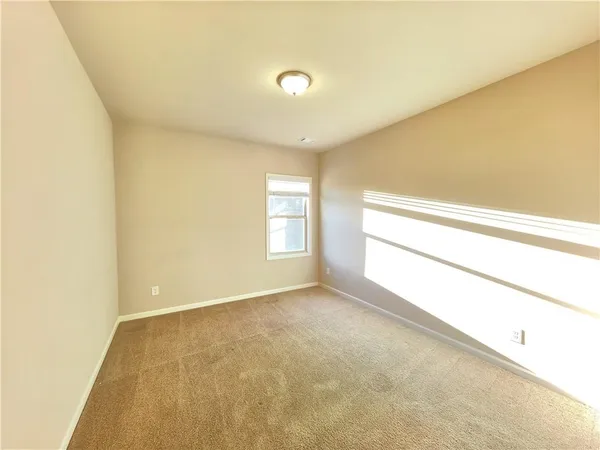 a view of an empty room and window