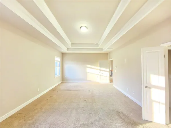a spacious bathroom with a double vanity sink and a mirror