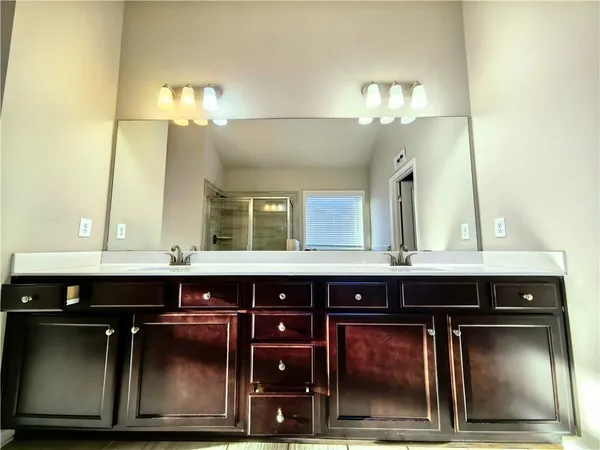 a bathroom with a bathtub and a shower