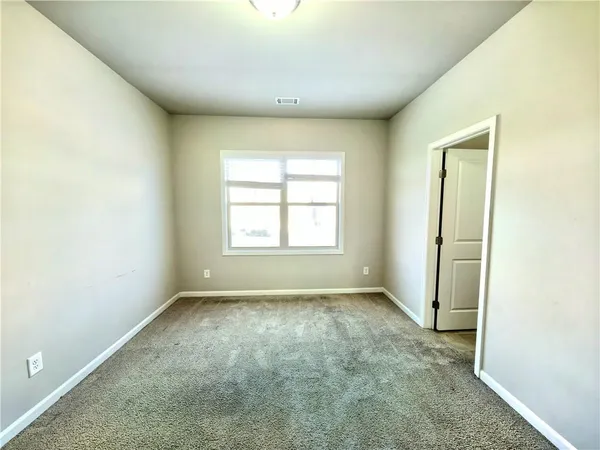 a bathroom with a double vanity sink toilet mirror and bathtub