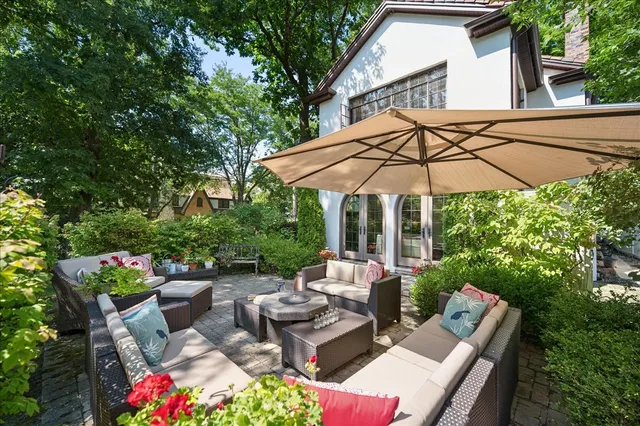 a view of backyard of house with seating space