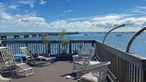 a view of a balcony with chairs
