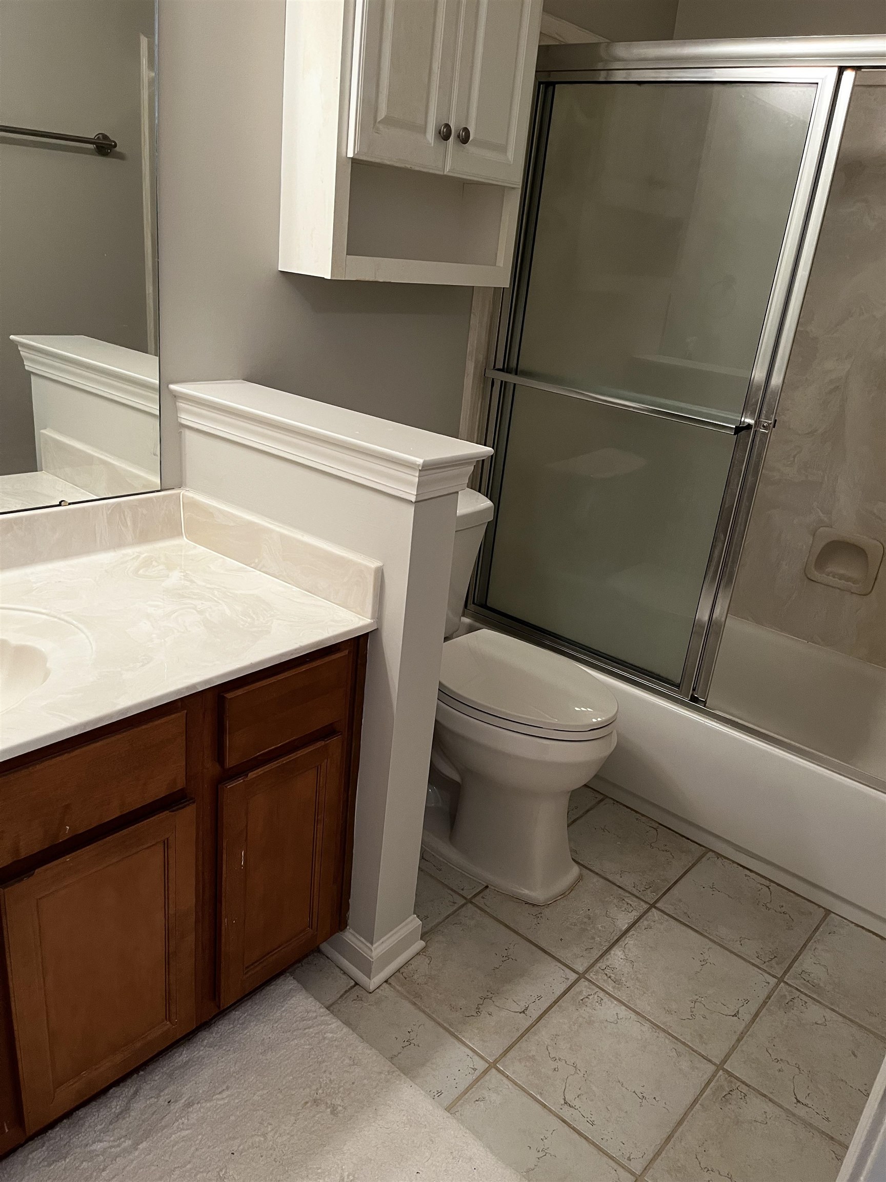 1182 Collierville Arlington Road Collierville, TN 38017 - Photo 23 of 34 a bathroom with a toilet and a sink