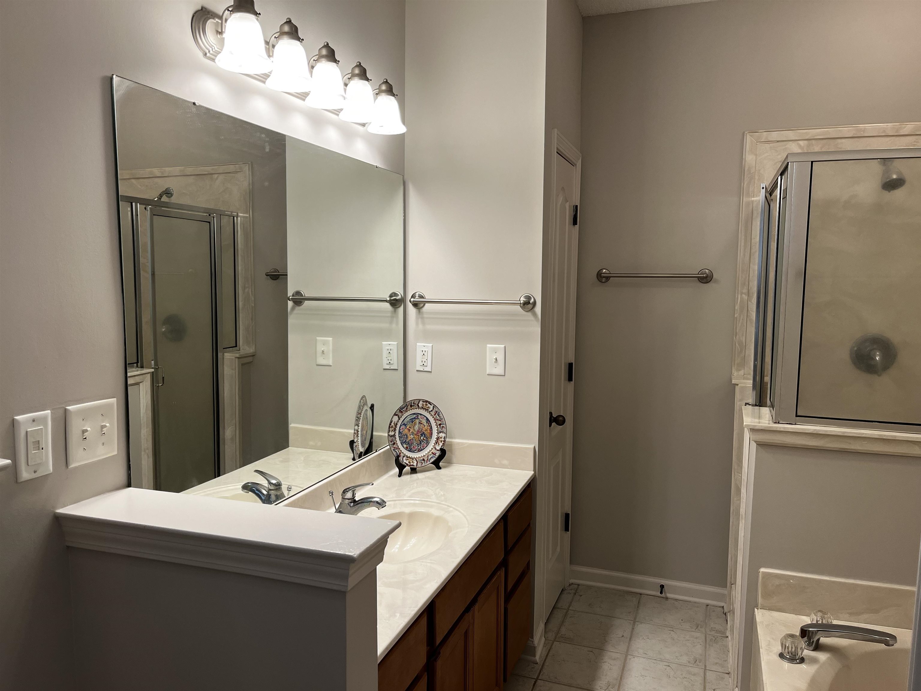 1182 Collierville Arlington Road Collierville, TN 38017 - Photo 24 of 34 a bathroom with a sink mirror and vanity