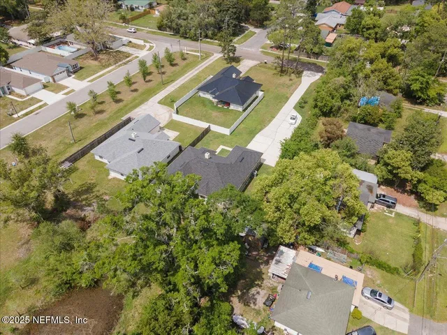 an aerial view of residential houses with outdoor space