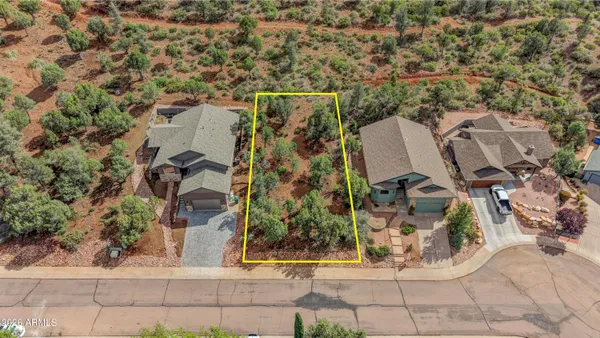 an aerial view of a residential apartment building with a yard