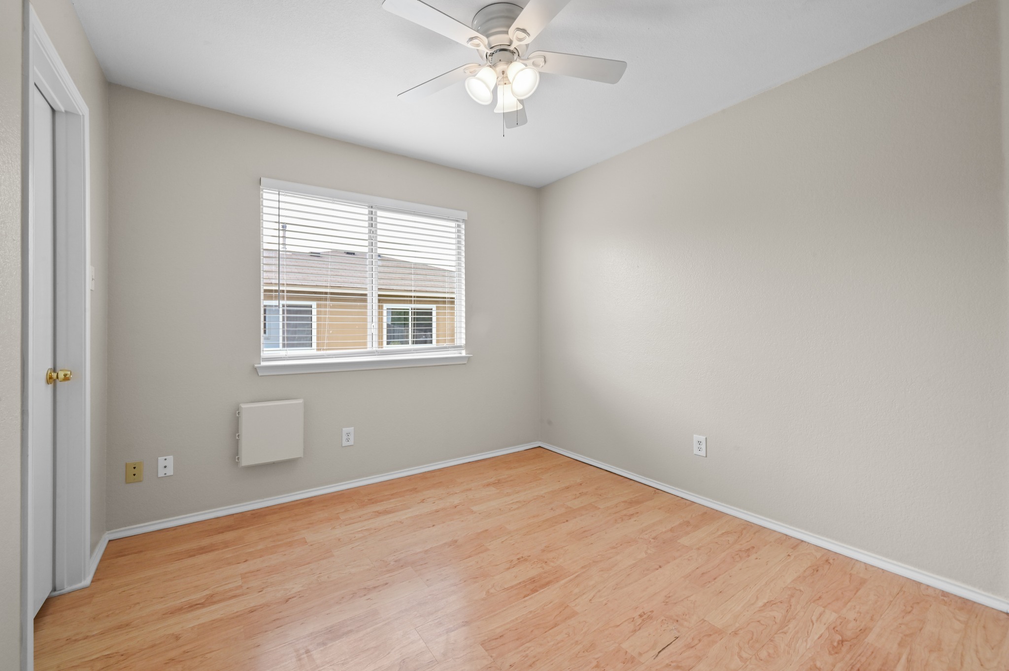 112 Mason Reed Cove Kyle, TX 78640 - Photo 18 of 26 a view of a room with a ceiling fan and a window