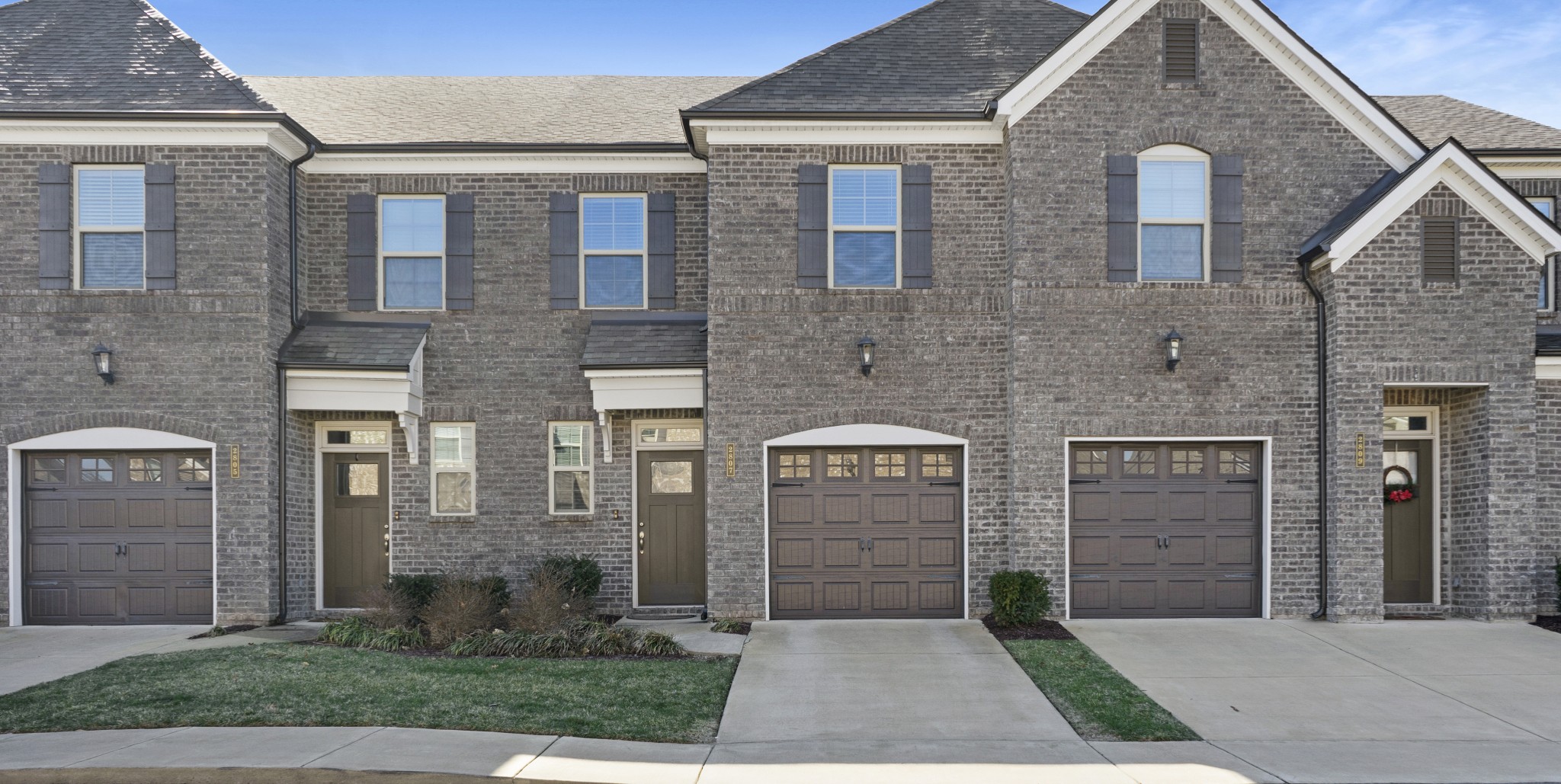 a front view of a house with yard
