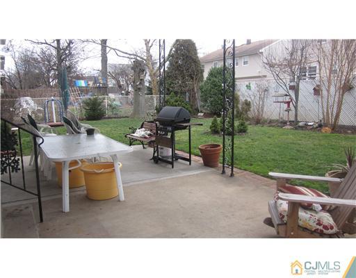 57 South Cliff Road Colonia, NJ 07067 - Photo 13 of 15 a backyard of a house with table and chairs