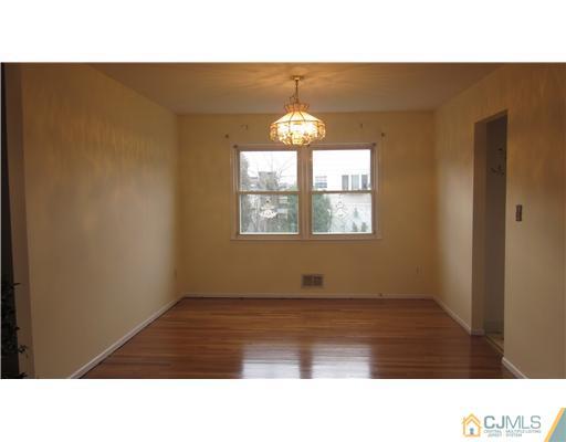 57 South Cliff Road Colonia, NJ 07067 - Photo 3 of 15 a black and white photo of a living room