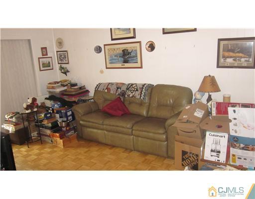 57 South Cliff Road Colonia, NJ 07067 - Photo 6 of 15 a living room with furniture and a couch