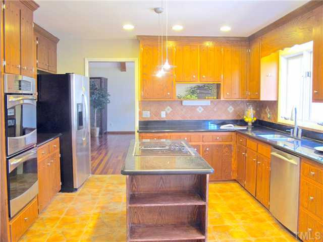 8521 Kempton Road Raleigh, NC 27615 - Photo 8 of 25 Full view of kitchen looking toward Great Room Kitchen