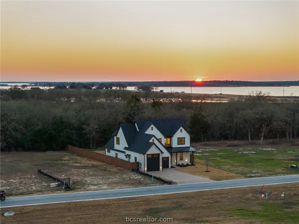 a view of a lake with a big yard