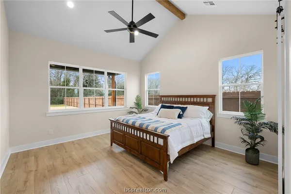 a bathroom with a double vanity sink a mirror and shower
