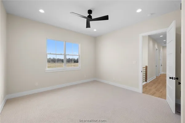 a kitchen with white cabinets and a sink