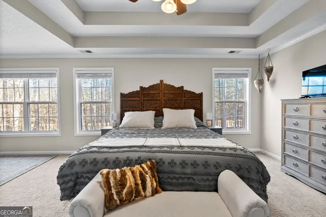 a bedroom with a bed and window